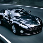 Vanquish V12 Black Driving High Angle Wallpaper