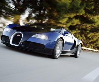 Veyron Blue Driving Front Low Angle Wallpaper