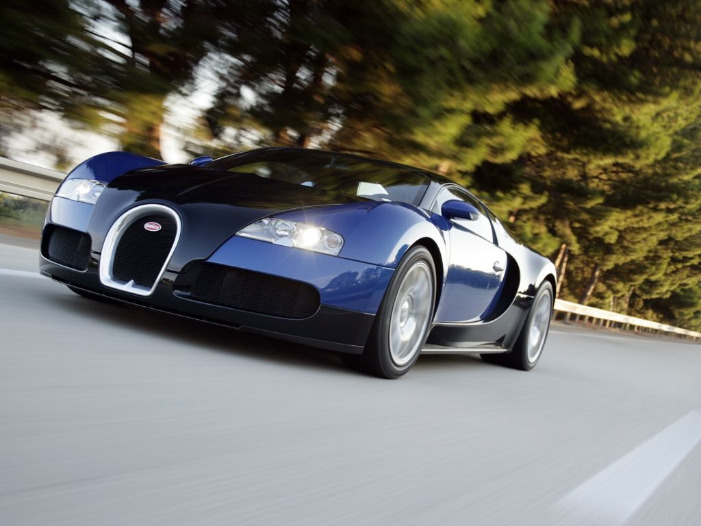 Veyron Blue Driving Front Low Angle Wallpaper 1024x768